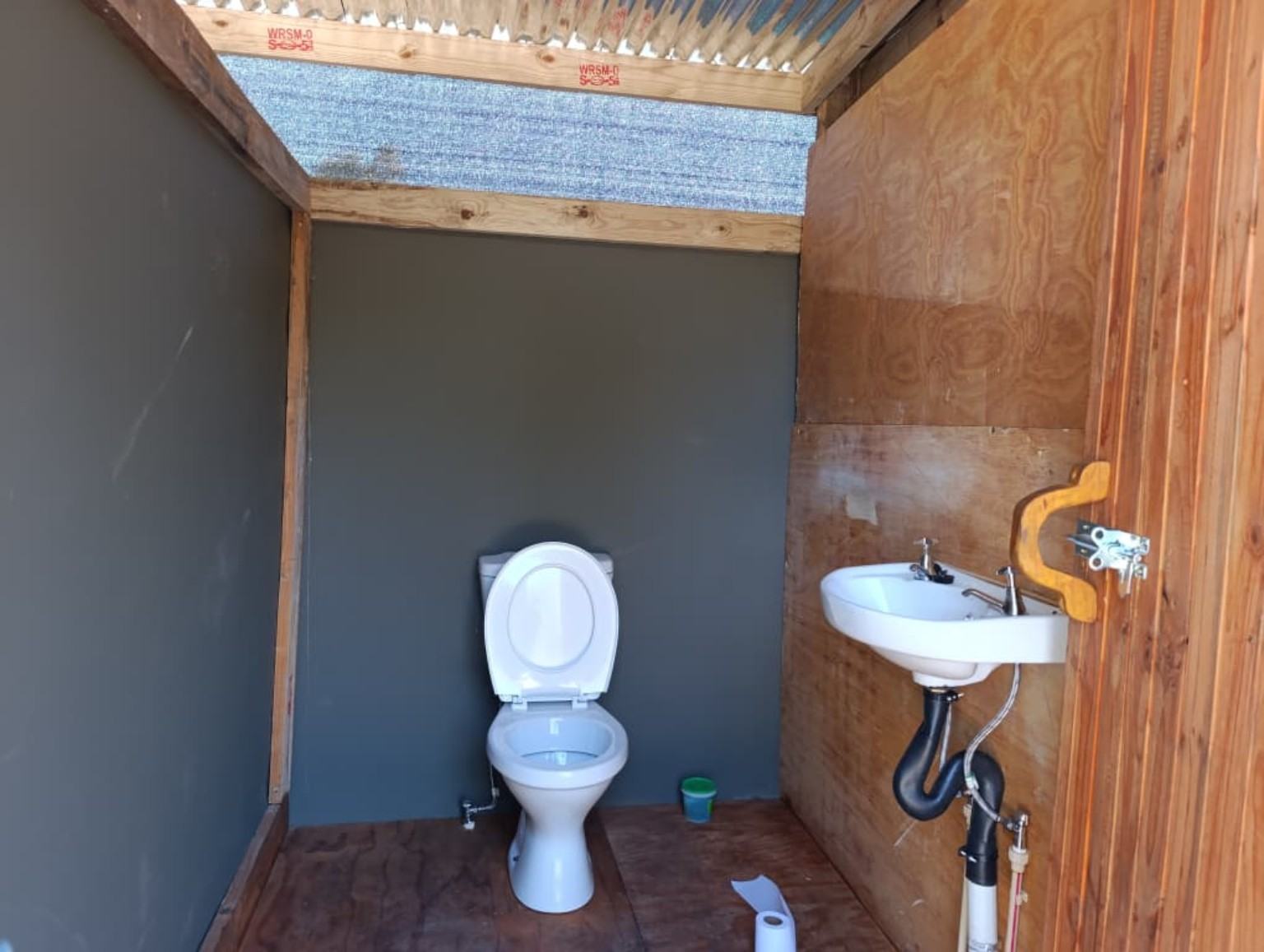 Toilet and basin inside the ablutions
